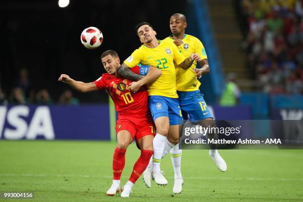 Eden Hazard of Belgium competes with Fagner and Fernandinho of Brazil during the 2018 FIFA World Cup Russia Quarter Final match between Brazil and...