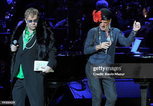 Sting and Elton John perform on stage during the Almay concert to celebrate the Rainforest Fund's 21st birthday at Carnegie Hall on May 13, 2010 in...