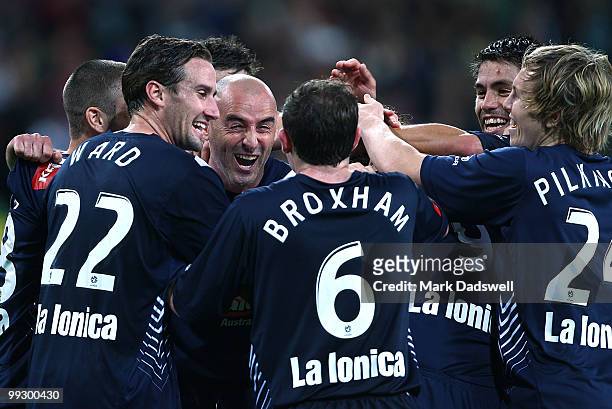 Kevin Muscat of the Victory is congratulated by teammates after setting up a penalty for Semir Sivic to score during the Kevin Muscat Testimonial...
