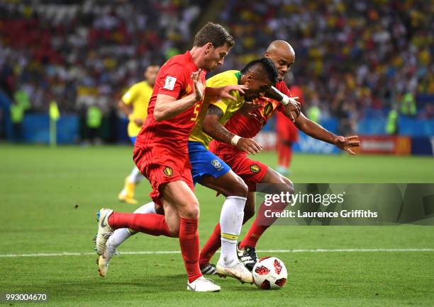 Jan Vertonghen and Vincent Kompany of Belgium put pressure on Paulinho of Brazil during the 2018 FIFA World Cup Russia Quarter Final match between...