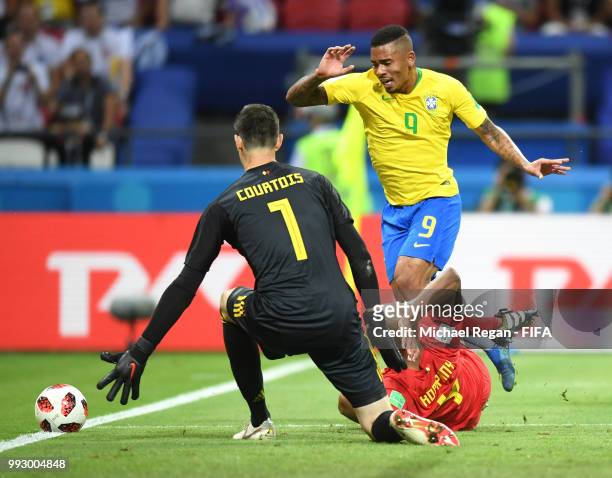 Vincent Kompany of Belgium tackles Gabriel Jesus of Brazil inside the penalty area during the 2018 FIFA World Cup Russia Quarter Final match between...
