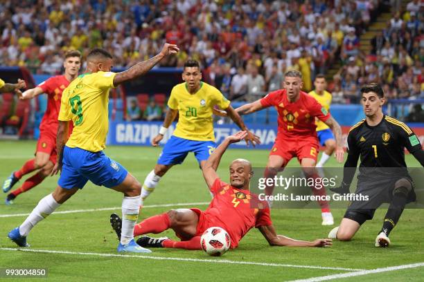 Vincent Kompany of Belgium tackles Gabriel Jesus of Brazil inside the penalty area during the 2018 FIFA World Cup Russia Quarter Final match between...