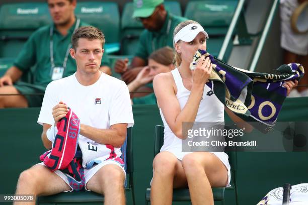 Neal Skupski and Naomi Broady of Great Britain talk against Joe Salisbury and Katy Dunne of Great Britain during their Mixed Doubles first round...
