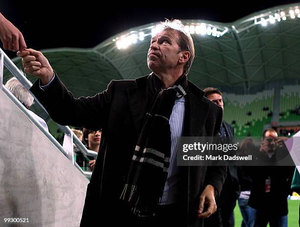 Pim Verbeek coach of the Socceroos signs autographs for fans during the Kevin Muscat Testimonial match between Melbourne Victory and the Come Play XI...