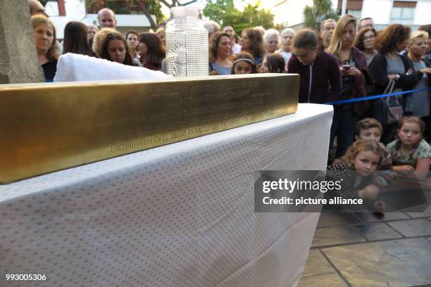 Pupils and children watch the laying of a Stolperstein at the Pestalozzi-Schule in Buenos Aires, Argentina, 30 October 2017. The memorial honours the...