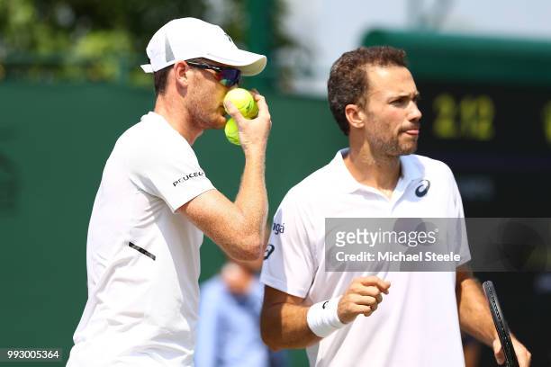 Bruno Soares of Brazil and Jamie Murray of Great Britain talk against Paolo Lorenzi of Italy and Albert Ramos-Vinolas of Spain during their Men's...