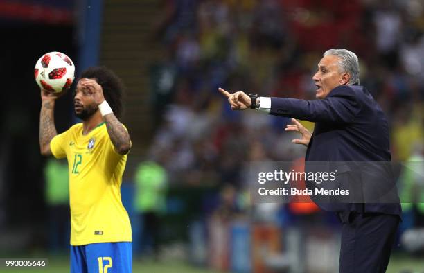 Tite, Head coach of Brazil gives his team instructions as Marcelo of Brazil holds the ball during the 2018 FIFA World Cup Russia Quarter Final match...