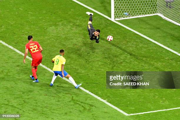 Belgium's goalkeeper Thibaut Courtois dives to stop a shot on goal by Brazil's forward Gabriel Jesus during the Russia 2018 World Cup quarter-final...