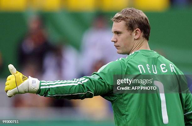 Germany's goalkeeper Manuel Neuer gestures during the friendly football match Germany vs Malta in the western German city of Aachen on May 13, 2010...