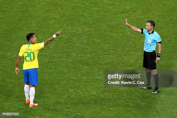Roberto Firmino of Brazil argues with the Referee Milorad Mazic during the 2018 FIFA World Cup Russia Quarter Final match between Brazil and Belgium...