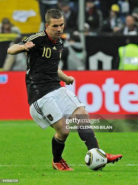 Germany's striker Lukas Podolski plays the ball during the friendly football match Germany vs Malta in the western German city of Aachen on May 13,...