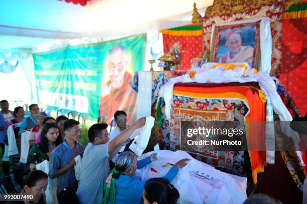 Tibetan people offering rituals towards the poster of Dalai Lama during 83rd birthday celebration of the exiled spiritual leader the Dalai Lama in...