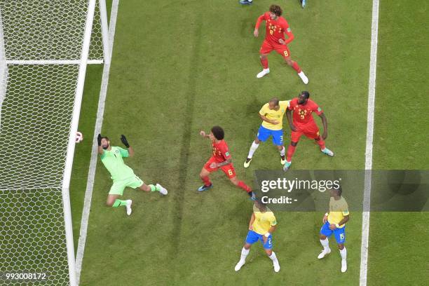 Brazil's goalkeeper Alisson concedes a goal during the Russia 2018 World Cup quarter-final football match between Brazil and Belgium at the Kazan...