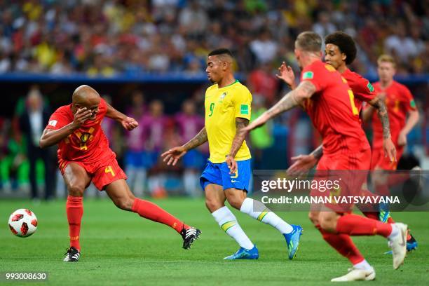 Belgium's defender Vincent Kompany attempts a tackle on Brazil's forward Gabriel Jesus during the Russia 2018 World Cup quarter-final football match...