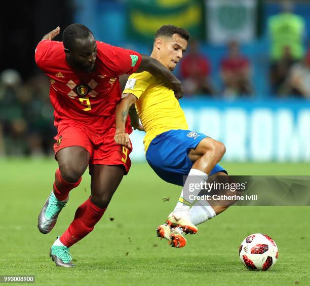 Philippe Coutinho of Brazil is challenged by Romelu Lukaku of Belgium during the 2018 FIFA World Cup Russia Quarter Final match between Brazil and...