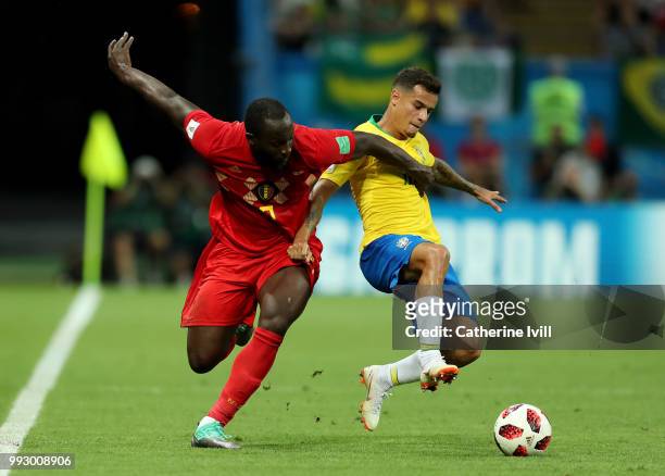 Philippe Coutinho of Brazil is challenged by Romelu Lukaku of Belgium during the 2018 FIFA World Cup Russia Quarter Final match between Brazil and...