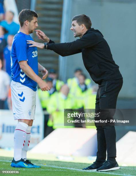 Rangers manager Steven Gerrard gives instructions to Jon Flanagan on the touchline during a pre-season friendly match at Ibrox Stadium, Glasgow.