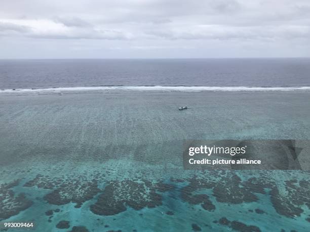 Beached ship on a reef can be seen before the Fiji Islands, 20 October 2017. The island state is host to the World Climate Conference COP23 which is...