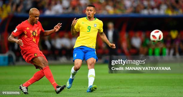 Belgium's defender Vincent Kompany clears the ball ahead of Brazil's forward Gabriel Jesus during the Russia 2018 World Cup quarter-final football...