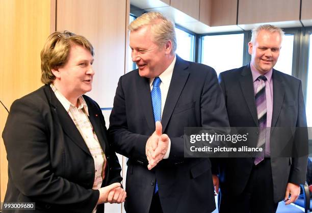 Faction leader Bernd Althusmann speaks to Johanne Modder, chairwoman of thr SPD faction in the Lower Saxonian State Parliament, before the start of...