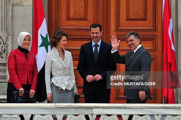 Turkish President Abdullah Gul and Syrian President Bashar al-Assad pose with their wives Hayrunnisa Gul and Asma during a welcoming ceremony in...