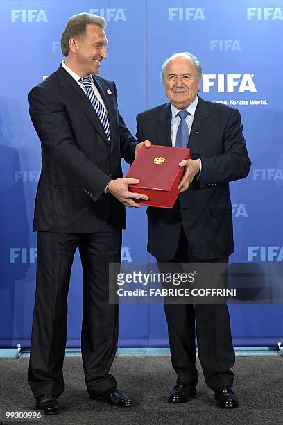 Russian deputy prime-minister Igor Shuvalov poses with FIFA president Sepp Blatter after delivering the Russian World Cup football bid book during an...