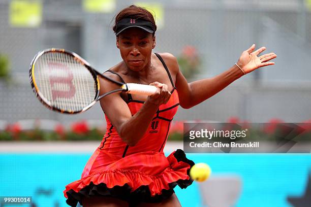 Venus Williams of the USA plays a forehand to Samantha Stosur of Australia in their quarter final match during the Mutua Madrilena Madrid Open tennis...