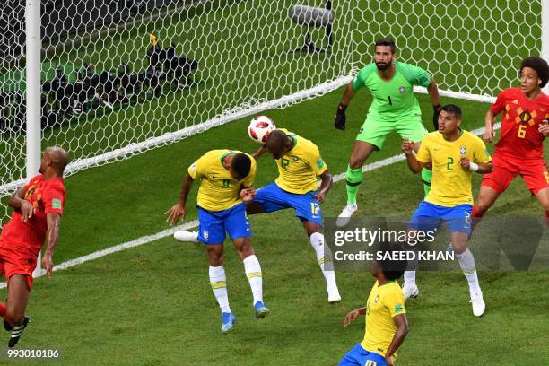 The ball, shot by Belgium's defender Vincent Kompany , hits Brazil's midfielder Fernandinho to score an own goal during the Russia 2018 World Cup...