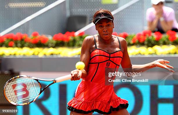 Venus Williams of the USA plays a forehand to Samantha Stosur of Australia in their quarter final match during the Mutua Madrilena Madrid Open tennis...