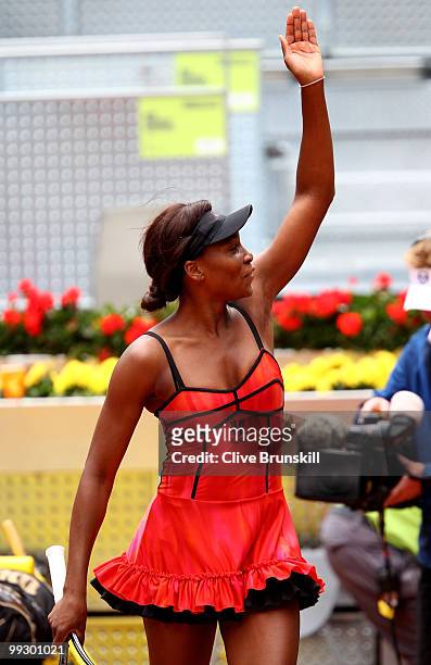 Venus Williams of the USA waves to the crowd after her straight sets victory against Samantha Stosur of Australia in their quarter final match during...