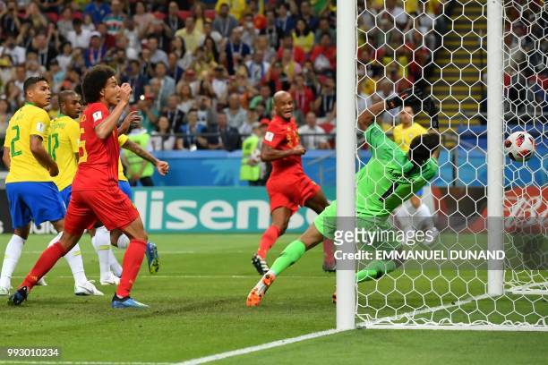Brazil's goalkeeper Alisson concedes the opening goal during the Russia 2018 World Cup quarter-final football match between Brazil and Belgium at the...