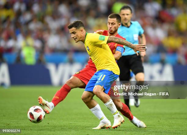Eden Hazard of Belgium tackles Philippe Coutinho of Brazil during the 2018 FIFA World Cup Russia Quarter Final match between Brazil and Belgium at...