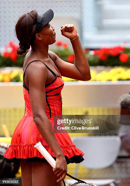 Venus Williams of the USA celebrates to her family box after her straight sets victory against Samantha Stosur of Australia in their quarter final...