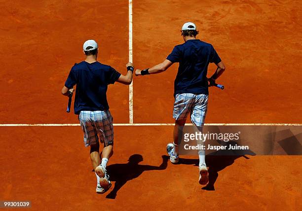 Mike Bryan of the USA and Bob Bryan of the USA celebrate their win in their quarter final match against Mariusz Frystenberg of Poland and Marcin...