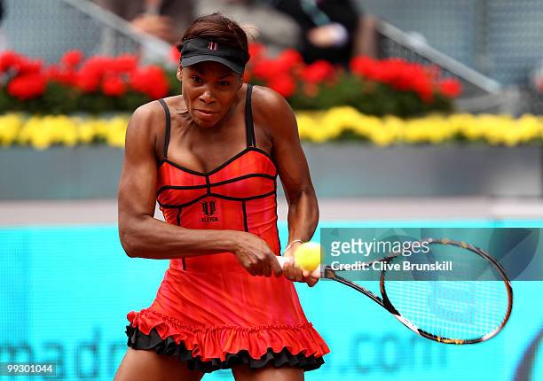 Venus Williams of the USA plays a backhand to Samantha Stosur of Australia in their quarter final match during the Mutua Madrilena Madrid Open tennis...