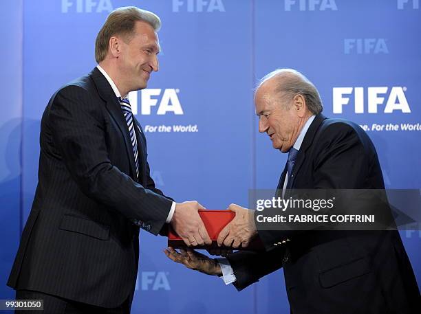 Russian deputy prime-minister Igor Shuvalov delivers the Russia World Cup football bid book to FIFA president Sepp Blatter after during an official...