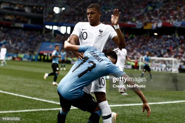 Kylian Mbappe, Diego Laxalt during 2018 FIFA World Cup Russia Quarter Final match between Uruguay and France at Nizhny Novgorod Stadium on July 6,...