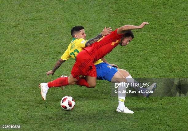 Fagner of Brazil tackles Eden Hazard of Belgium during the 2018 FIFA World Cup Russia Quarter Final match between Brazil and Belgium at Kazan Arena...