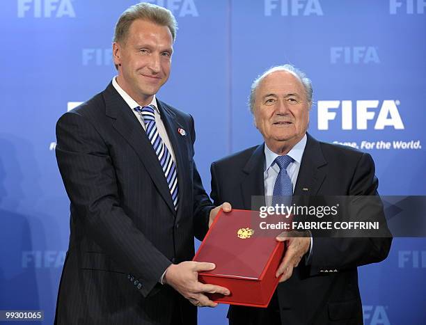 Russian deputy prime-minister Igor Shuvalov delivers the Russia World Cup football bid book to FIFA president Sepp Blatter after during an official...