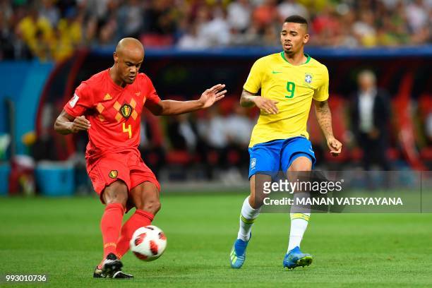 Belgium's defender Vincent Kompany clears the ball ahead of Brazil's forward Gabriel Jesus during the Russia 2018 World Cup quarter-final football...