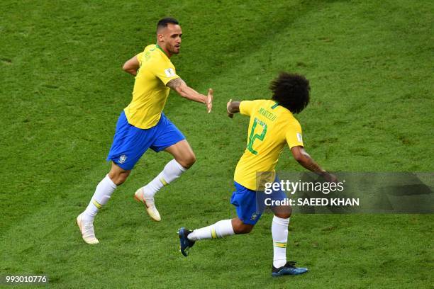 Brazil's midfielder Renato Augusto celebrates scoring a goal with Brazil's defender Marcelo during the Russia 2018 World Cup quarter-final football...