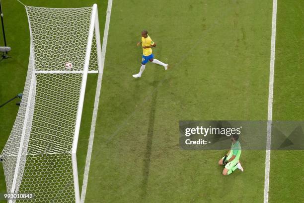 Brazil's goalkeeper Alisson reacts after conceding a second goal during the Russia 2018 World Cup quarter-final football match between Brazil and...