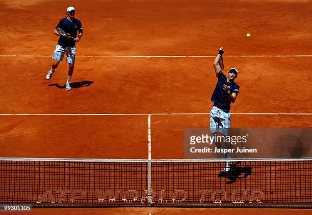 Mike Bryan of the USA jumps to smash a backhand with his doubles partner Bob Bryan of the USA in their quarter final match against Mariusz...