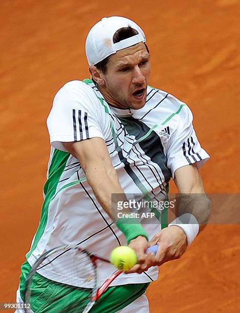 Austrian Jurgen Melzer returns a ball to Spaniard Nicolas Almagro during their Madrid Masters match on May 14, 2010 at the Caja Magic sports complex...