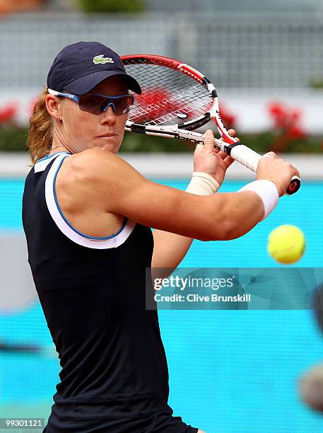 Samantha Stosur of Australia plays a backhand to Venus Williams of the USA in their quarter final match during the Mutua Madrilena Madrid Open tennis...