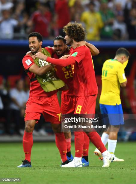 Mossua Dembele, Nacer Chadli, and Marouane Fellaini of Belgium celebrate following their sides victory in the 2018 FIFA World Cup Russia Quarter...