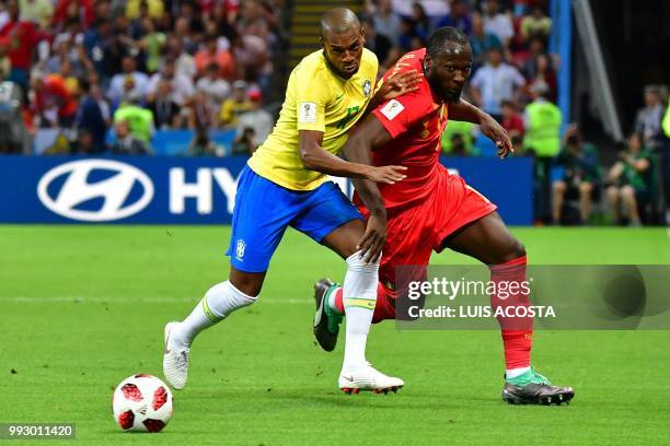 Brazil's midfielder Fernandinho vies for the ball with Belgium's forward Romelu Lukaku during the Russia 2018 World Cup quarter-final football match...