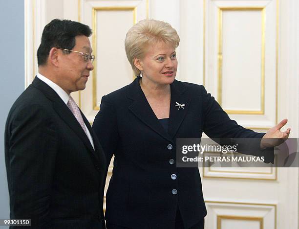 China's Minister of Commerce Chen Deming arrives for a meeting with Lithuania President Dalia Grybauskaite in the presidential palace in Vilnius on...