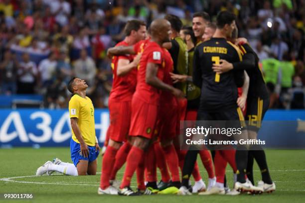 Thiago Silva of Brazil looks dejected as the Belgium team celebrate their victory following the 2018 FIFA World Cup Russia Quarter Final match...