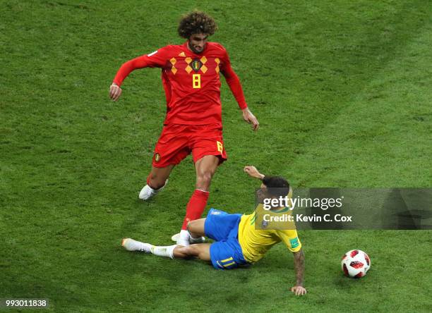 Philippe Coutinho of Brazil tackles Marouane Fellaini of Belgium during the 2018 FIFA World Cup Russia Quarter Final match between Brazil and Belgium...